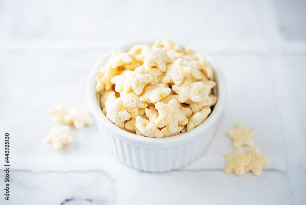 Dried wheat stars for breakfast in a bowl Dried wheat stars for breakfast in a bowl