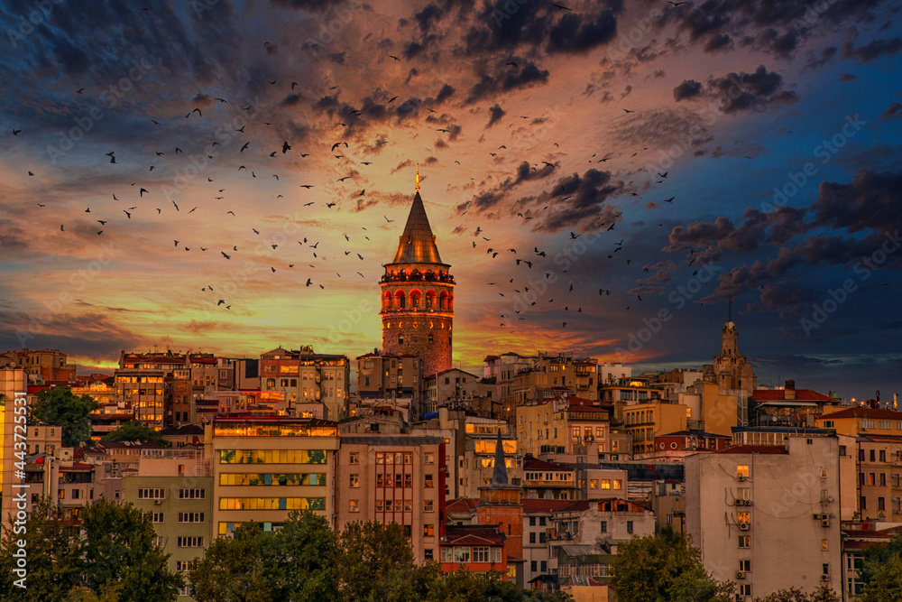 Sunset and birds in galata tower. Galata Tower is one of the tallest and oldest towers in Istanbul. The 63 meters (206 feet) tall tower offers panoramic views of the old city.