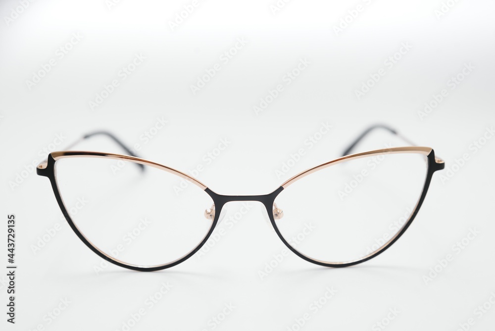 Female eyeglasses macro detail over a white background. Horizontal Female eyeglasses macro detail over a white background. Horizontal