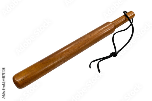 Antique wood truncheon from the 1920s isolated on white.