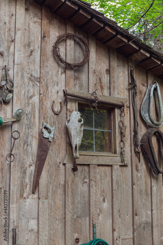 Rustic Decorations Hanging on Side of Wood Shed