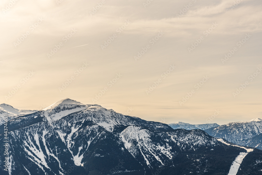 Beautiful snow-capped Columbia Mountains against the blue sky in British Columbia Canada