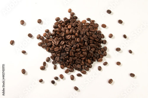 Roasted coffee beans isolated on white background.