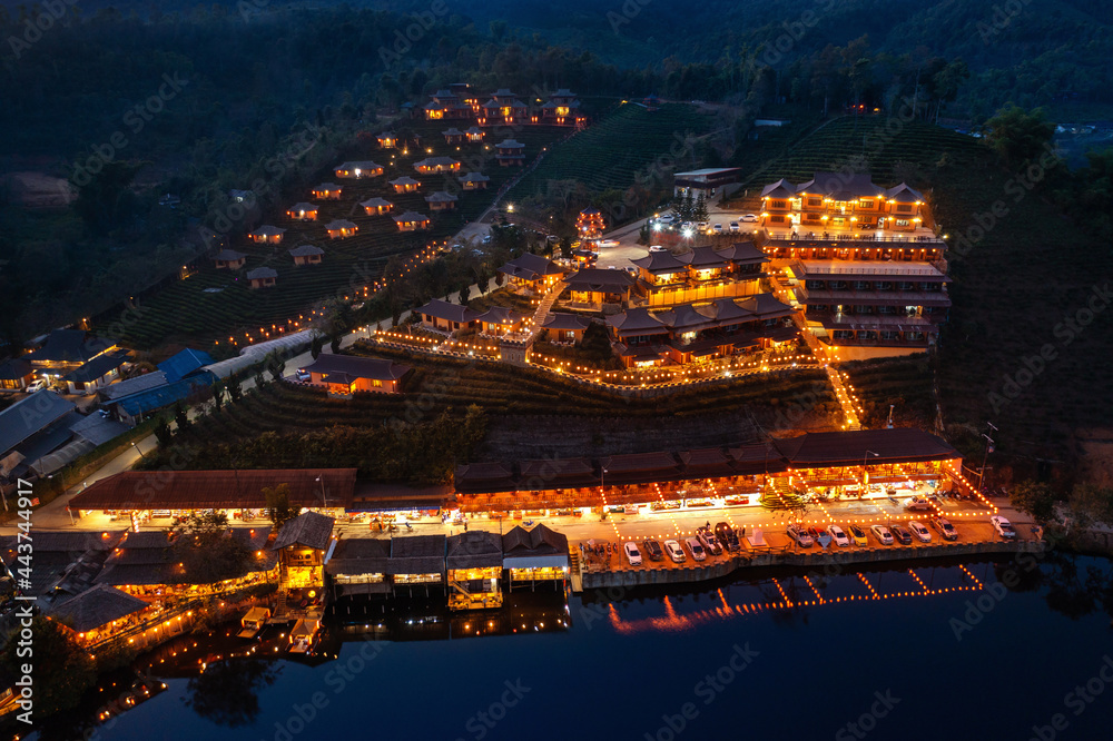 Fototapeta premium Aerial view of Rak thai village at night in Mae Hong Son province, Thailand.