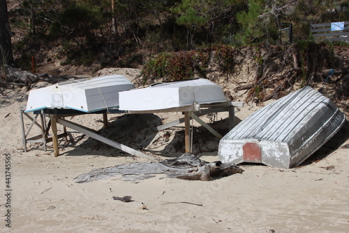 Upturned boats on the beach near Dennes Point, North Bruny, Tasmania, Australia.. photo