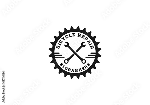 logo for bicycle repair shop or place with gear and wrench