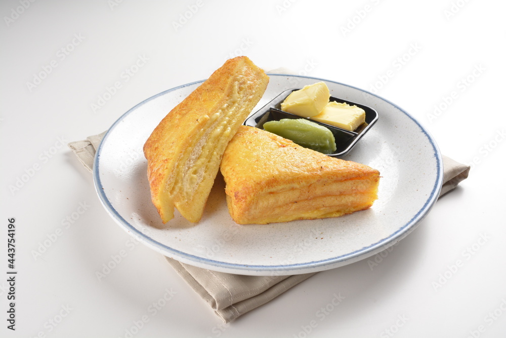 baked layer French cheese egg toast with kaya jam and butter with half boiled egg in bowl western mixed asian halal menu baked layer French cheese egg toast with kaya jam and butter with half boiled egg in bowl western mixed asian halal menu