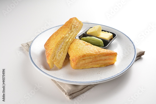 baked layer French cheese egg toast with kaya jam and butter with half boiled egg in bowl western mixed asian halal menu photo