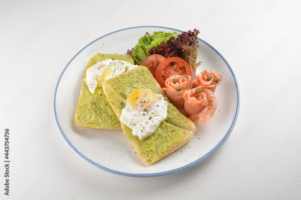 western luxury breakfast with avocado toast, boiled egg, smoked salmon fish, fried potato cake and salad halal breakfast menu western luxury breakfast with avocado toast, boiled egg, smoked salmon fish, fried potato cake and salad halal breakfast menu