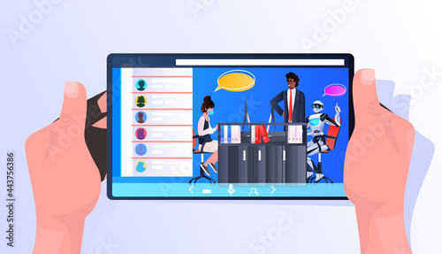 businesspeople discussing with robot during meeting on tablet screen chat bubble communication artificial intelligence
