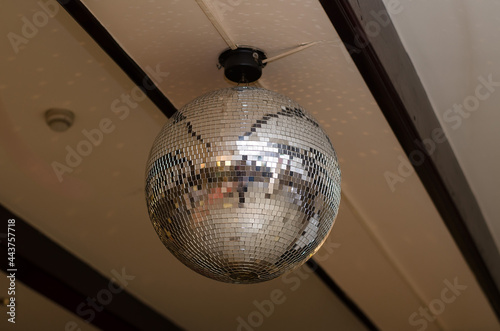 Mirrored disco ball on the ceiling in a restaurant photo