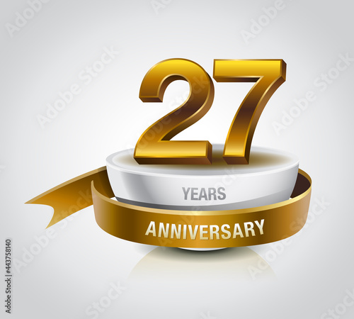 27 years golden anniversary logo celebration with ring and ribbon.