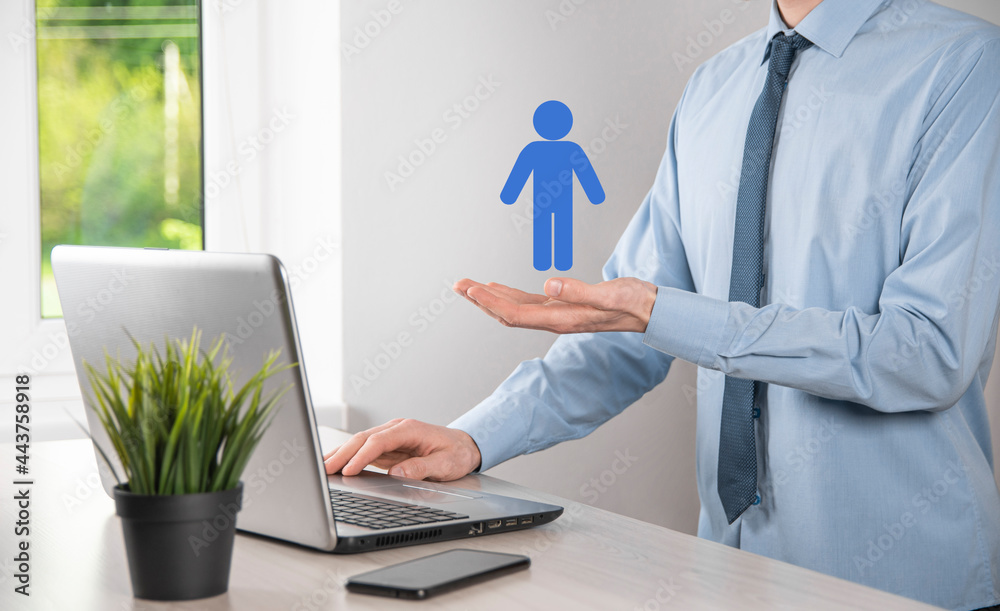 Businessman holds man person icon on dark tone background.HR Human ,people iconTechnology Process System Business with Recruitment, Hiring, Team Building. Organisation structure concept Businessman holds man person icon on dark tone background.HR Human ,people iconTechnology Process System Business with Recruitment, Hiring, Team Building. Organisation structure concept