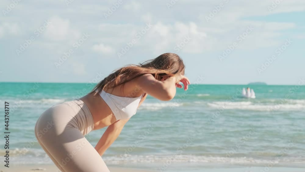 Women exercising on the beach Take a break after exhausting Women exercising on the beach Take a break after exhausting
