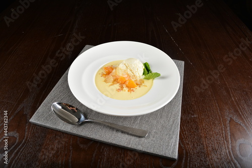 chilled mango fruit sago pomelo sweet soup with vanilla ice cream in dark background dessert halal menu