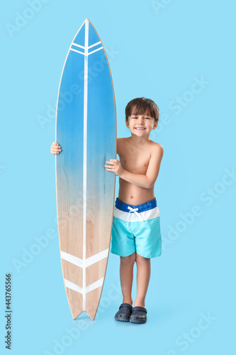 Cute little boy with surfbo...