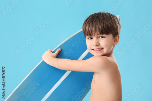 Cute little boy with surfbo...