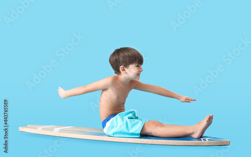 Cute little boy with surfbo...