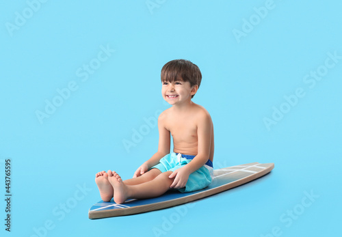 Cute little boy with surfbo...
