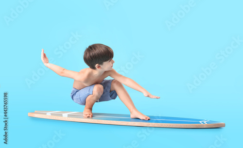 Cute little boy with surfbo...