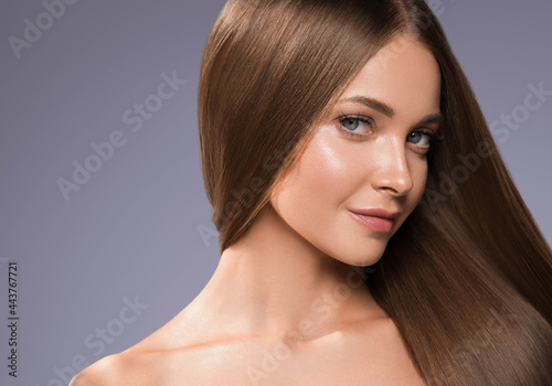 Beautiful woman with long beautiful smooth hair natural make up healthy skin