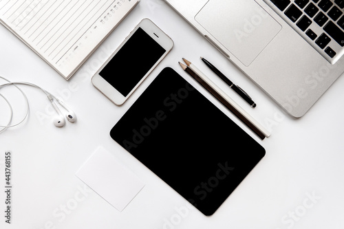 Office Accessories Top View.Laptop computer notebbok smartphone pencils and headphone isolated on white background.Working Device objects for freelance working concept.