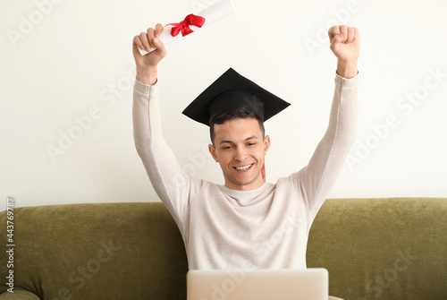 Happy male student on his g...