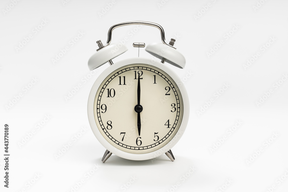 retro alarm clock on a white background. concept of early morning ascents. retro alarm clock on a white background. concept of early morning ascents.