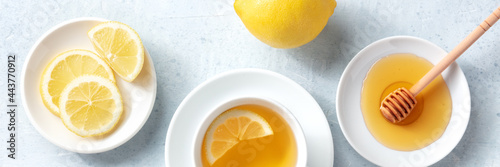 Lemon tea with honey overhead panoramic flat lay shot. Healthy organic citrus detox © laplateresca