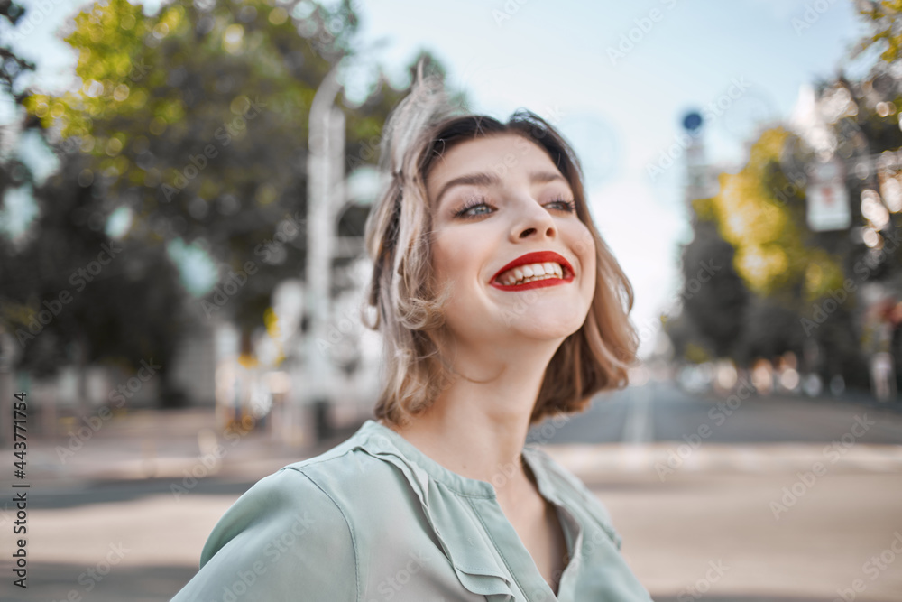 woman outdoors near building red lips walk