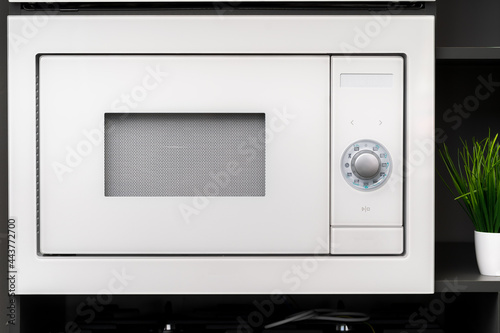 New modern microwave oven in a shop, close up