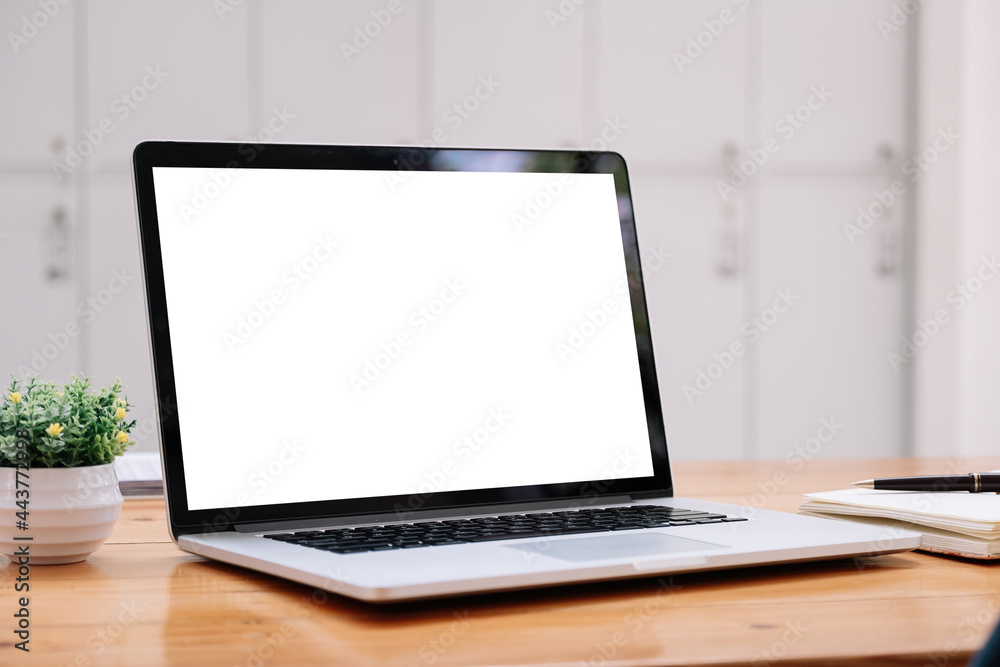 Laptop blank white screen on wood table at cafe shop, mockup, template for your text. Laptop blank white screen on wood table at cafe shop, mockup, template for your text.