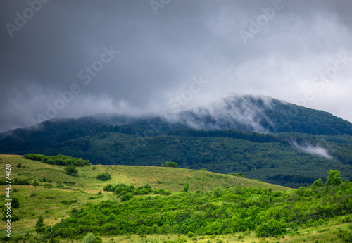 landscape with clouds over the mountains