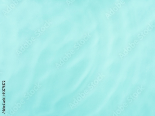 Blue water surface color background with ripples, circles and drops