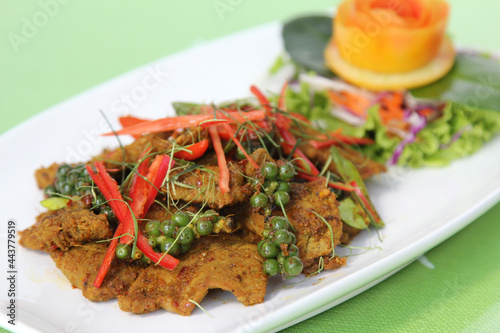 Stir fried cartilage pork with spicy curry paste (Thai call *Kua Kling*) thai food, in white dish