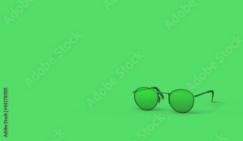 Sunglasses on pastel green background. Summer concept. Copy space.