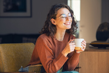 Beautiful woman relaxing and drinking hot tea