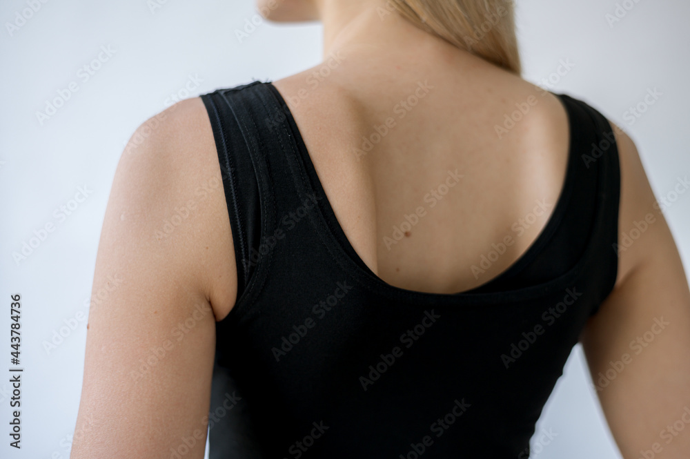 Black top on a girl with white skin. Open back Black top on a girl with white skin. Open back