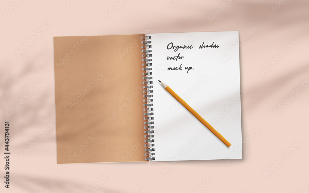 Open realistic notebook with pencil on abstract soft delicate beige background falling shadow overlay from plant. Open realistic notebook with pencil on abstract soft delicate beige background falling shadow overlay from plant.