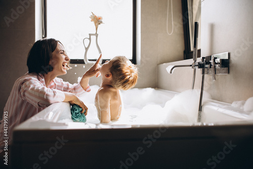 Bild auf Leinwand Mother washing little son in bathroom