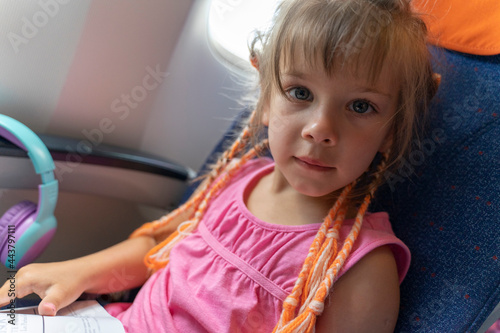 caucasian child girl on board the plane