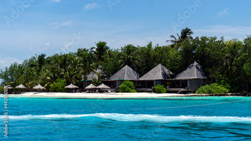 Tropical island, houses on the ocean © Vladislav