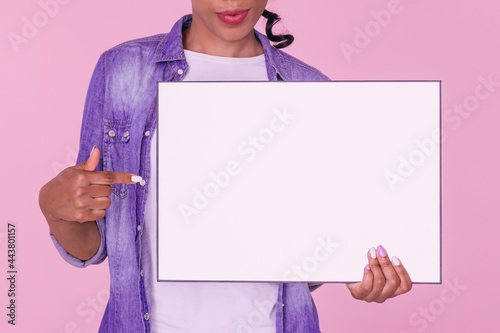 Close up of a blank board being held by a smiling woman