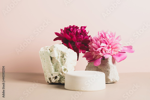 Fototapeta Naklejka Na Ścianę i Meble -  Modern abstract podium wooden geometric shapes stone green fresh wild plants flowers peony pastel pink background