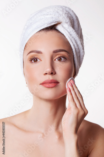 Beautiful skin care, portrait of woman, morning routine with cotton pads 