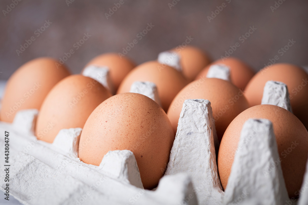 close-up view of brown chicken eggs in cardboard tray close-up view of brown chicken eggs in cardboard tray