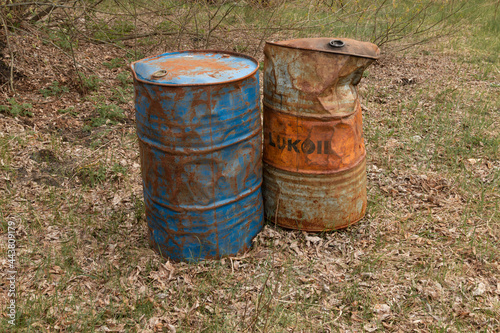 old rusty painted barrels outdoors