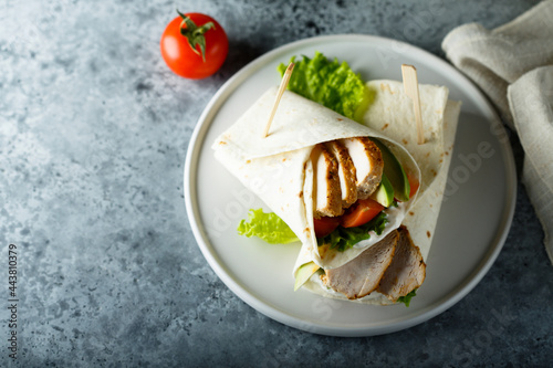 Homemade chicken wrap with vegetables photo