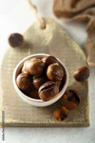 Roasted chestnuts in a white bowl