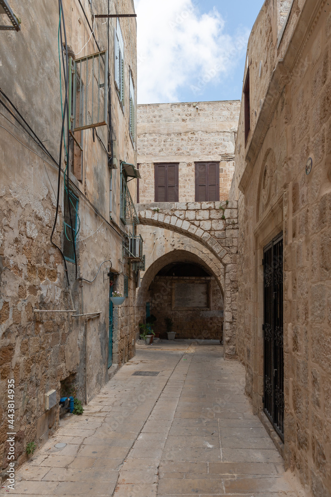 The tunnel  lined with stones passes under buildings in the old city of Acre in northern Israel